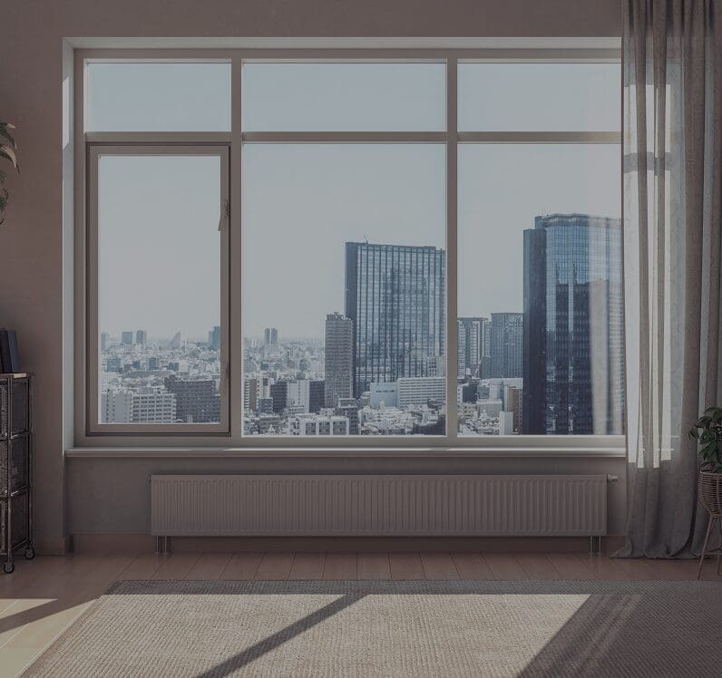 Cityscape view through modern apartment window.