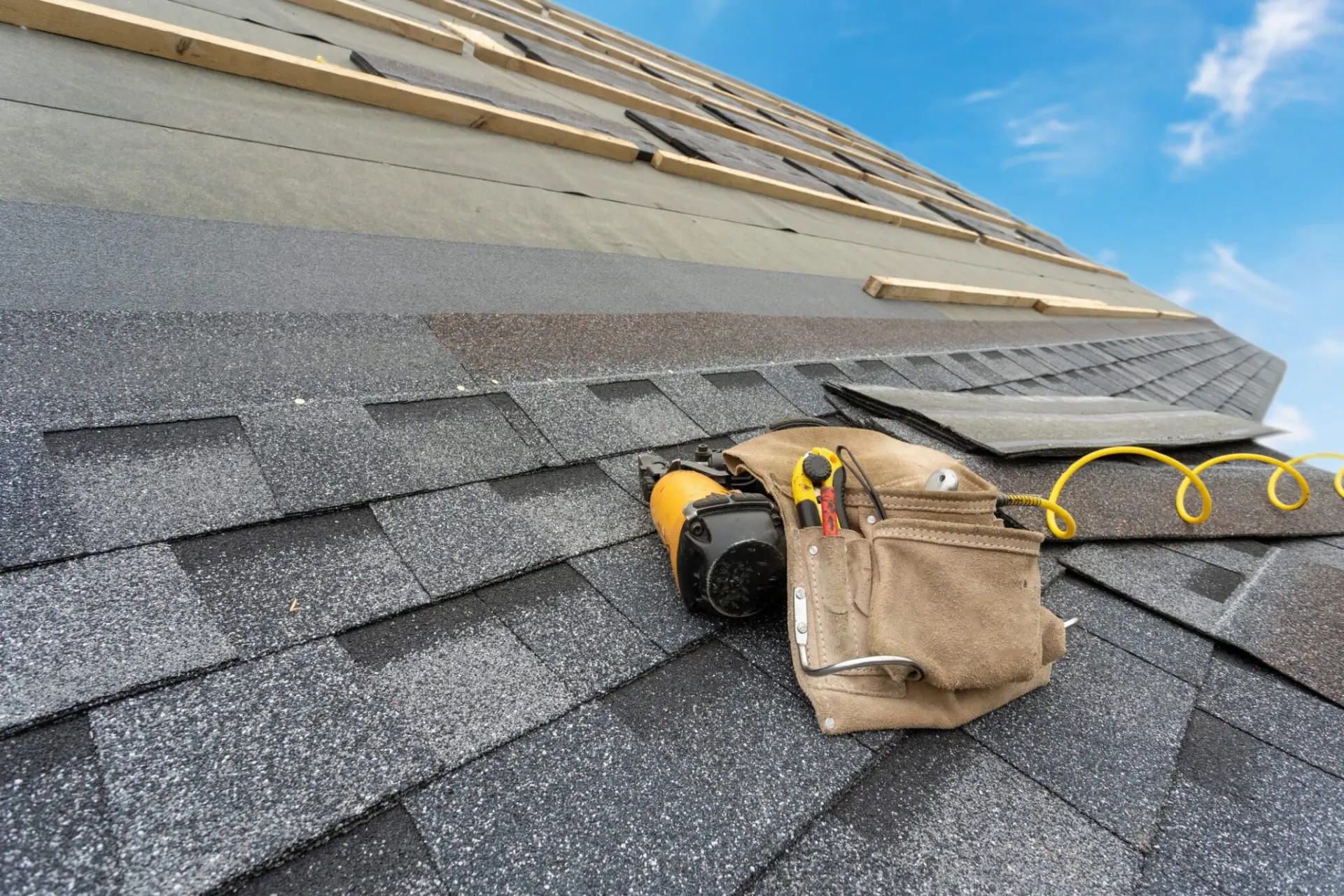 Asphalt shingles with nail gun and belt