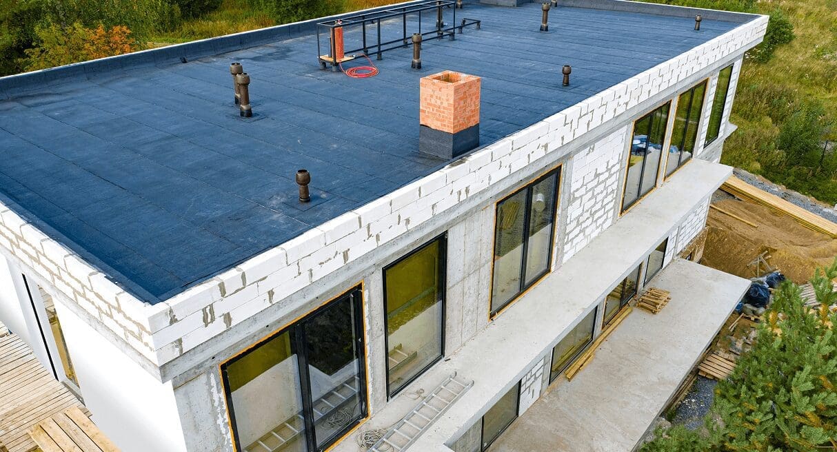 Modern flat roof building with black flooring